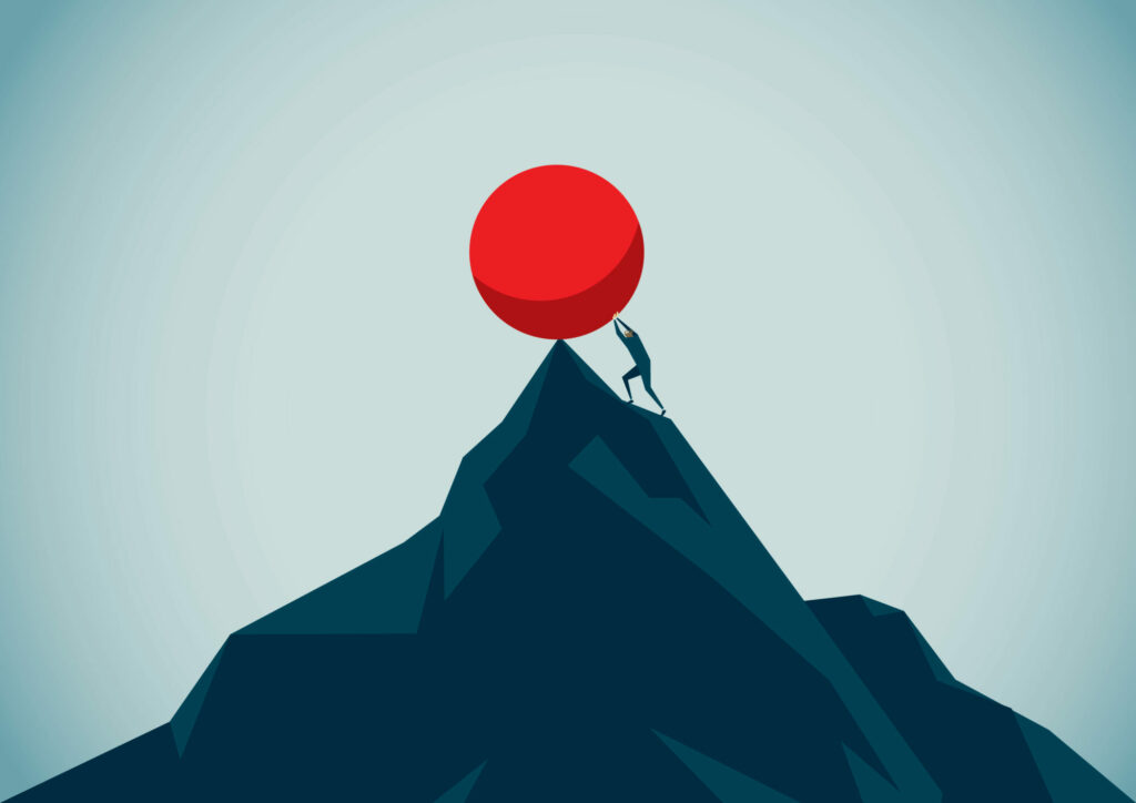 Pushing boulder up a mountain.