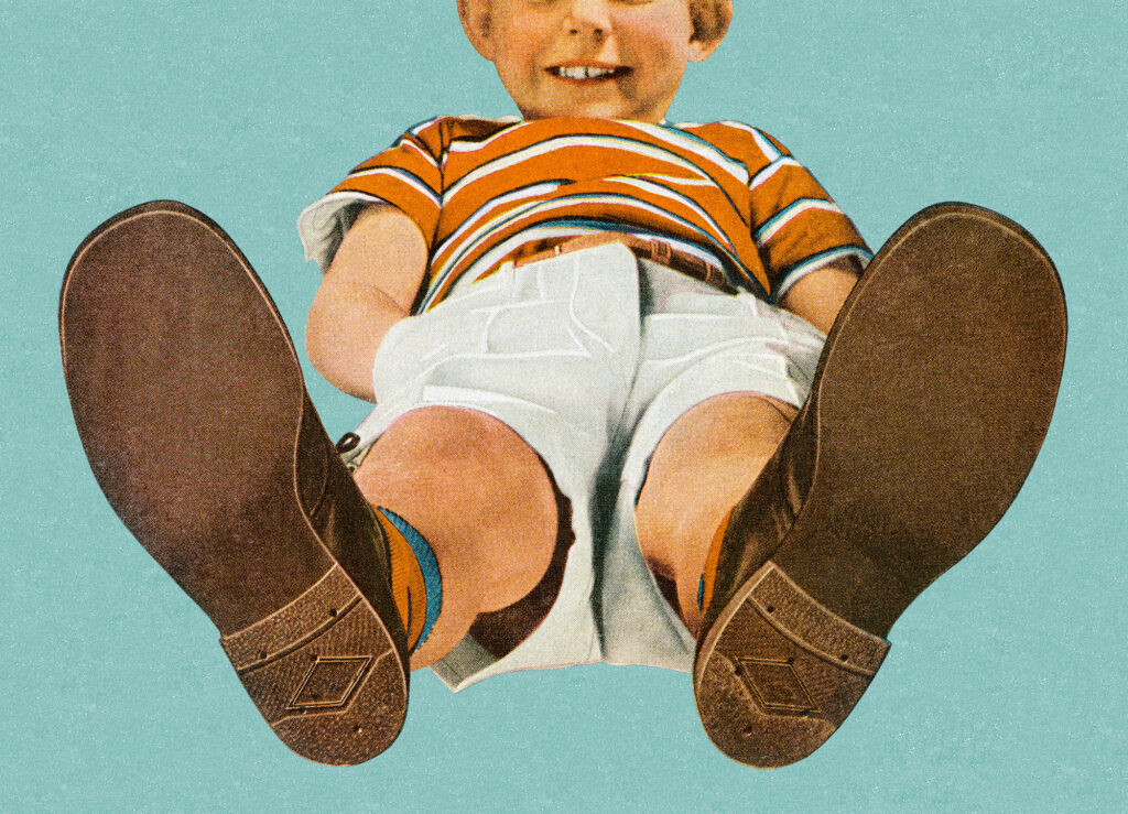 Boy standing feet up
